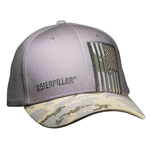 A gray structured cap with a digital camo visor featuring the Caterpillar brand logo and an American flag design.